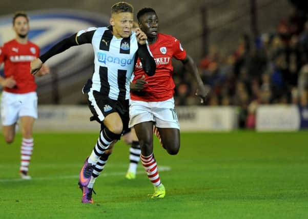 Dwight Gayle runs on to score at Barnsley in Newcastle's midweek win. Picture by Frank Reid