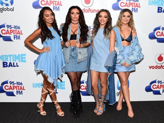 Little Mix are celebrating scoring their fourth number one single with break-up anthem Shout Out To My Ex.