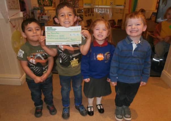 Four of the children at Nursery Time Kindergarten who took part in the Fake it or Bake it Macmillan fundraising event.