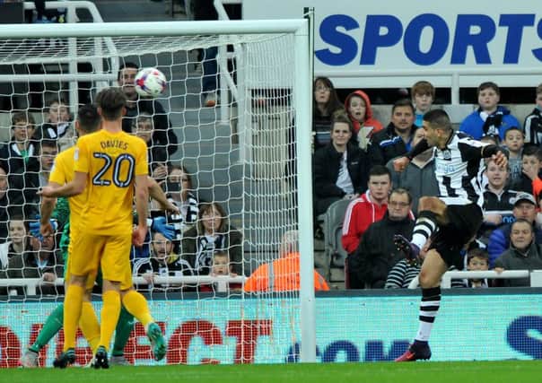 Aleksandar Mitrovic heads the first goal of his double against Preston last night. Picture by Frank Reid