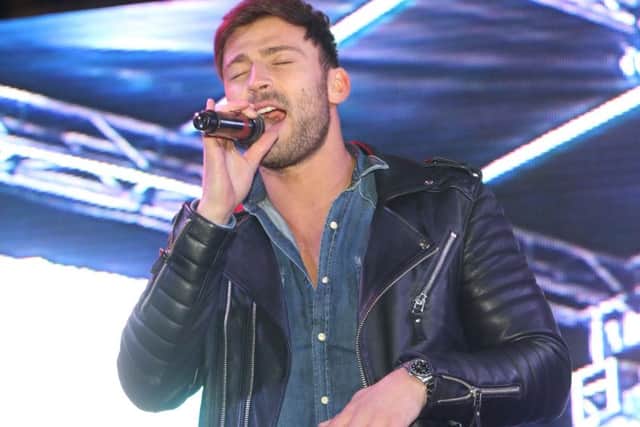 Jake Quickenden sings to the crowds.