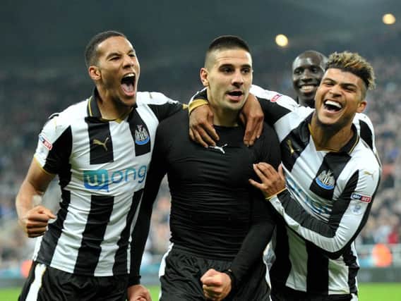 Isaac Hayden, Aleksandar Mitrovic and DeAndre Yedlin