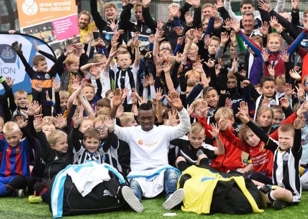 Newcastle United star Christian Atsu visits young footballers at the Newcastle United Foundation. The Ghana international has recently been appointed glodal ambassador of childrens charity, Arms Around A Child.