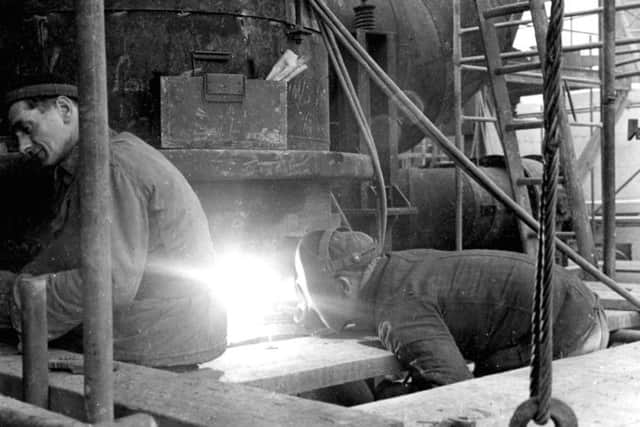 This photo from March 1967 shows men welding. Do you recognise the chap in the wool hat?