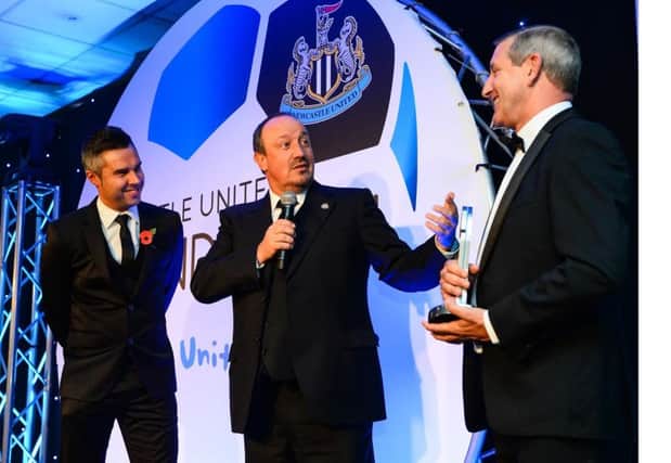 Sky Sports presenter Pete Graves joins Rafa Benitez in presenting Reggie Dornan with the Alder Sweeney Award
