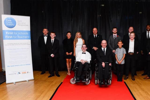 Rafa Benitez poses for a photograph with foundation award winners