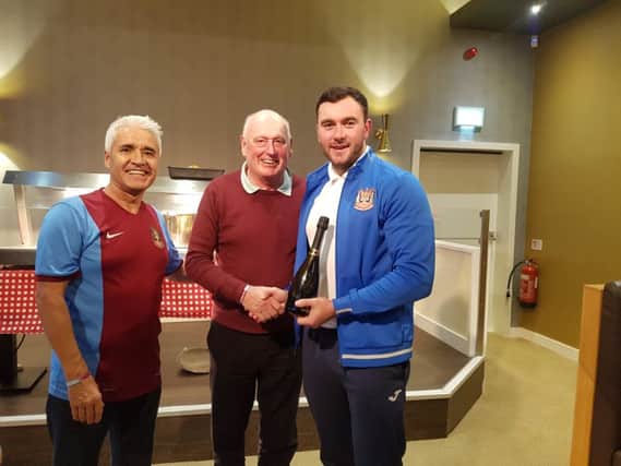 John Lewis, centre, presents Liam Connell with the man of the match award following South Shields win. Also pictured is fellow fan Mark Burns.