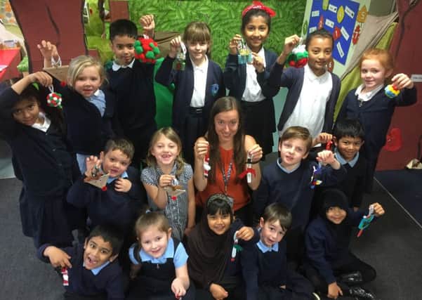Pupils at Hadrian Primary School in South Shields with Christmas decorations.