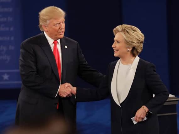 Republican presidential nominee Donald Trump shakes hands with Democratic presidential nominee Hillary Clinton. Picture: AP Photo.