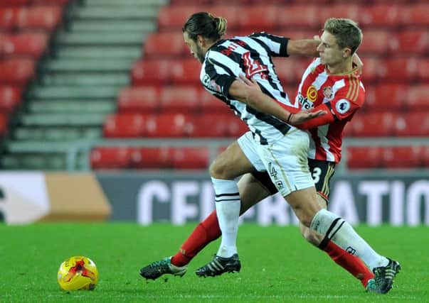 Sunderland Under-23s defender George Brady challenges ex-England man Alan Smith in last night's win over Notts County. Picture by Frank Reid