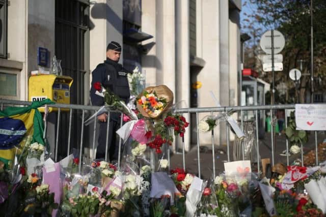 Flowers and tributes left close to the Bataclan concert hall in Paris.