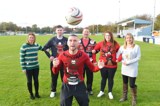 St Clare's Hospice Jolly Jumper appeal at South Shields FC. From left Kayleigh Dodd, Steven Wytcherly, team player Barrie Smith, Carl Ferguson, Alisha Henry and Sam Crutwell