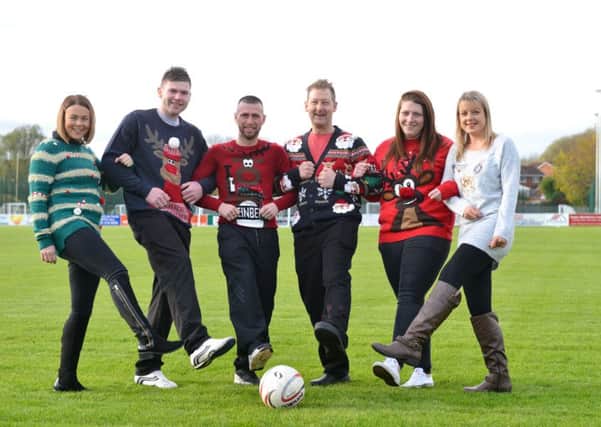 St Clare's Hospice Jolly Jumper appeal at South Shields FC. From left Kayleigh Dodd, Steven Wytcherly, team player Barrie Smith, Carl Ferguson, Alisha Henry and Sam Crutwell