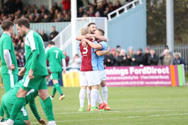 Danny Carson and Andrew Stephenson celebrate with goalscorer David Foley after South Shields went 2-0 up against Marske United. Image by Peter Talbot.