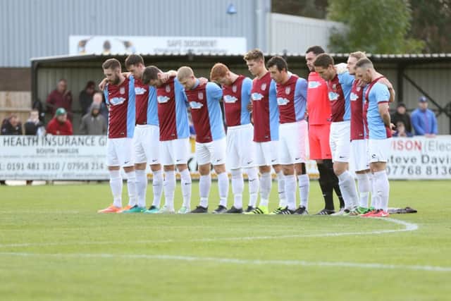 The two teams stood for a minute's silence ahead of the game to mark Remembrance weekend. Image by Peter Talbot.