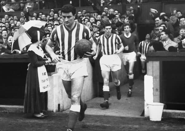 Charlie Hurley leading out Sunderland for a cup tie against Everton in February 1964.