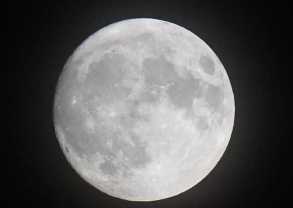 A rare supermoon will make the full lunar disc appear 14% bigger and up to 30% brighter than usual as it rises above the rooftops tonight.