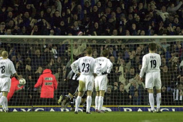 Leeds defenders can only watch as Alan Shearer scores his usual goal against the Whites.