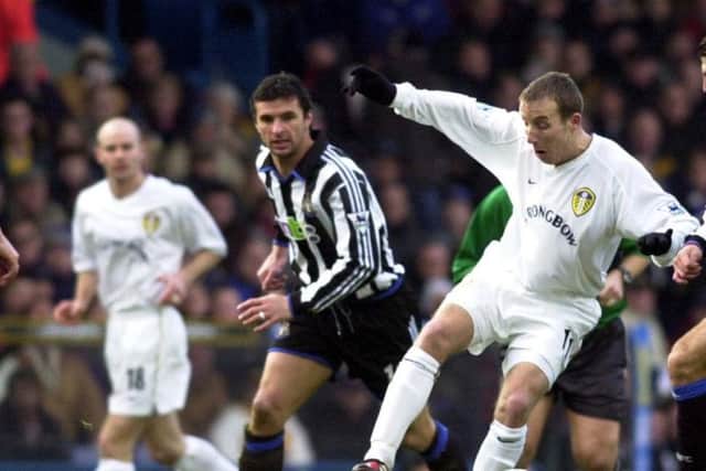 Leeds's Lee Bowyer, right, challenges old boy Gary Speed, centre.