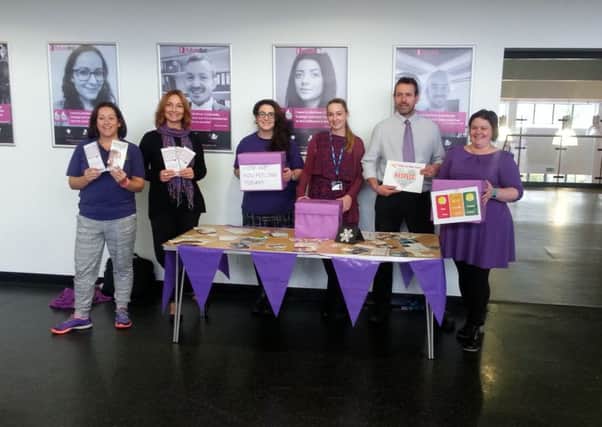 Mortimer Community College staff supporting the Light Up Purple on World Mental Health Day initiative.