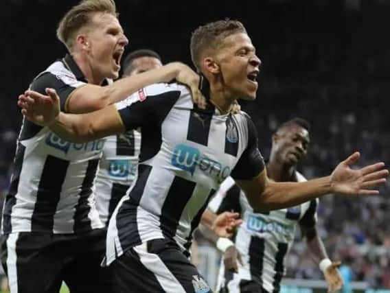 Dwight Gayle celebrating after scoring for Newcastle United