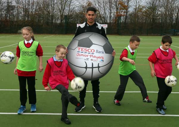 Newcastle star Ayoze Perez meets up with youngsters at the launch of the Tesco Bank Junior Players community programme