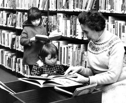 Back in 1973 Miss Elsie Ord. South Shields Schools Librarian, chats to three-year-old Janet McManus, in the new children's section of the old Central Library, while five-year-old Margaret Reah looks on.