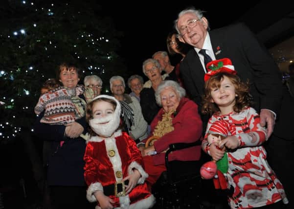 Councillors Tracey Dixon, Peter Boyack and Joyce Welsh join residents of Farding Lake Court, Marsden, at their Christmas tree light switch on. Picture by Tim Richardson