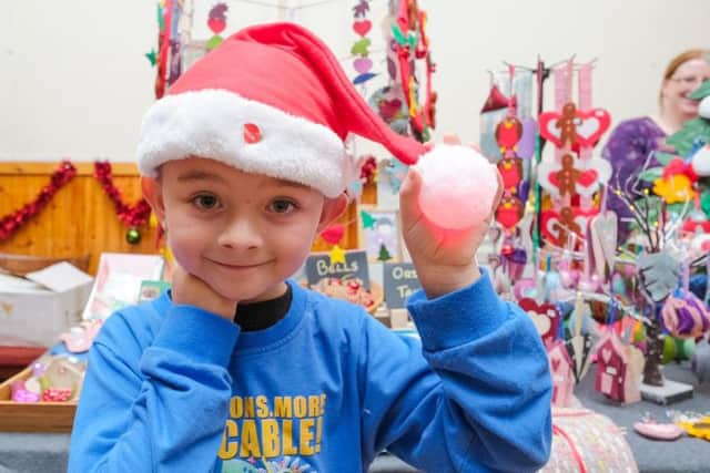 Connor Miller, from Marsden, gets into the Christmas spirit at last year's event.