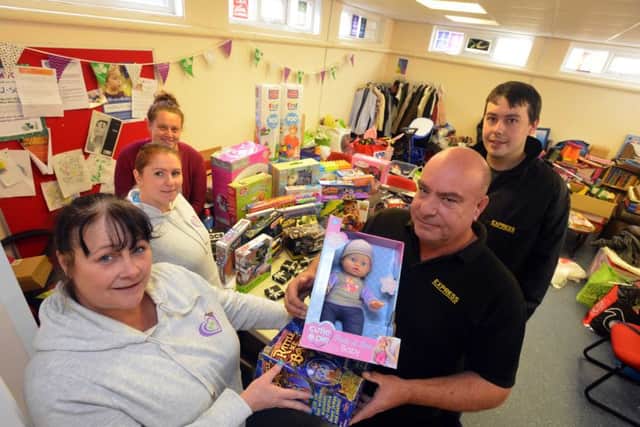 Hebburn Helps Christmas toy appeal.
Front Jo Durkin and Express taxi driver Keith Candlish. 
Back charity's Carla Kapranos, Angie Comerford and Express taxi driver Andre Ashston