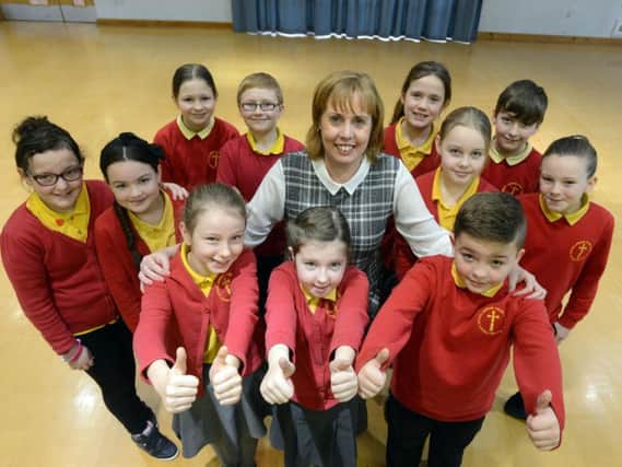 Jarrow Cross Primary headteacher Susan McBet with pupils after the school  received a 'Good' rating earlier this year
