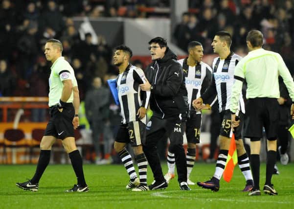 Newcastle's players complain to referee Stephen Martin following the 2-1 defeat to Forest. Picture by Frank Reid