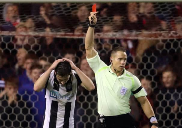 Newcastles Paul Dummett is sent off by referee Steve Martin.