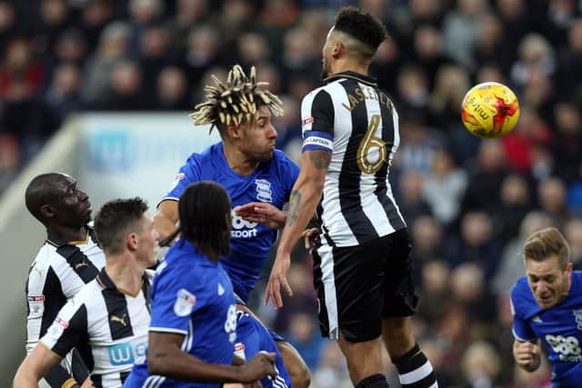 Birmingham's Ryan Shotton battles for the ball with Jamaal Lascelles