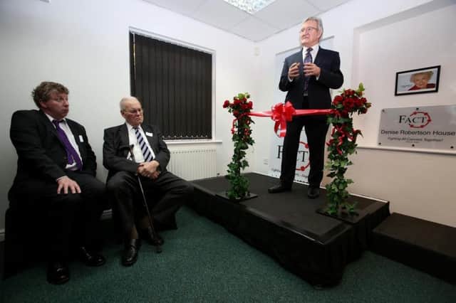 The official opening of Denise Robertson House, the new home of cancer charity FACT on Clasper Way, Swalwell, Gateshead. Dr Chris Steele from the This Morning TV show performs the opening watched by Denise's widower Bryan Thobron and her son Mark Robertson. Picture: CHRIS BOOTH