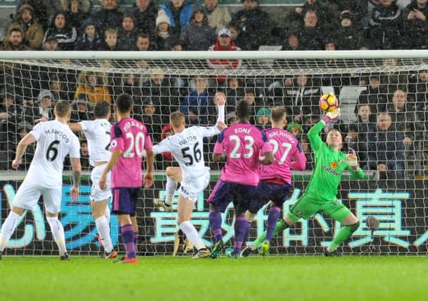 Jordan Pickford makes another save against Swansea