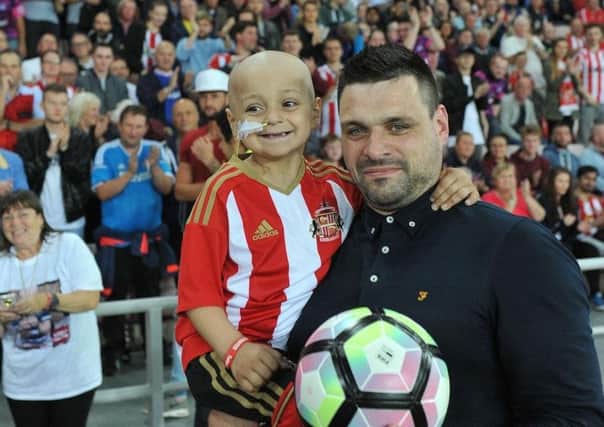 Bradley Lowery with dad Carl when he was mascot at the Sunderland v Everton game
