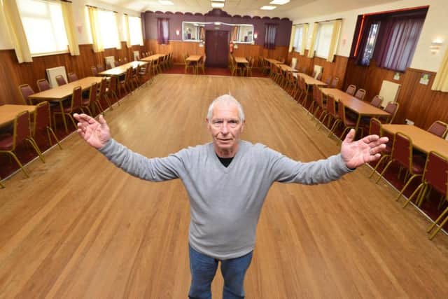 Tony McManus inside The Sutton Hall where new lights have been installed