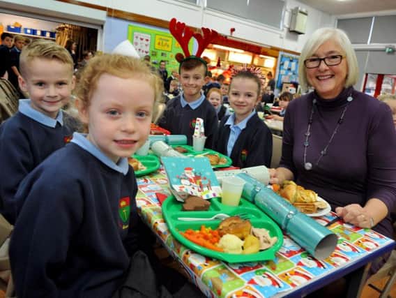 Coun Joan Atkinson, at St Oswald's Church of England Primary School, Hebburn, having Christmas lunch with pupils, Lyla Carr, Cole Christie, Grace Heale and Layton Rutherford.