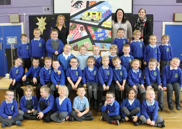 Simonside Primary School pupils with the artwork donated to South Tyneside District Hospital to be displayed in the main reception of the accident and emergency department.