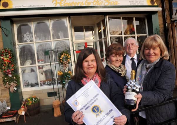 Whitburn Winter Festival Window competition winner Flowers by the Sea owner Helen Simpson and Christine Simpson with Coun Tracey Dixon and Peter Boyack.