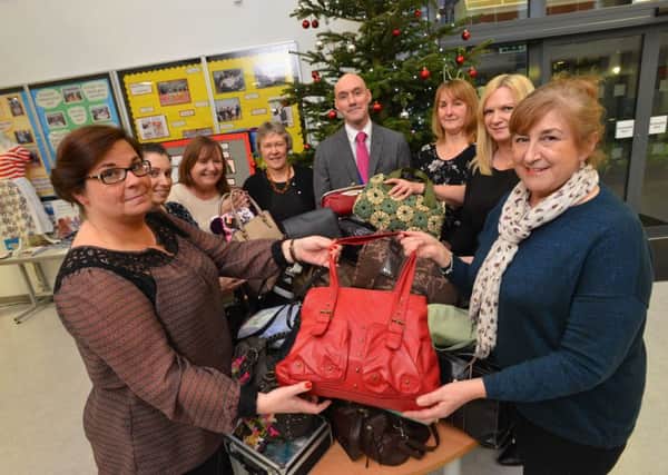 Jarrow School homless women bag collection.
Front from left staff Vicky Stonehouse and Hospitality and Hope Maureen Gribben