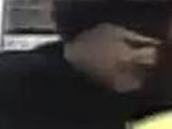 Image of a man police want to speak to in connection with the robbery of a shop in Hebburn.