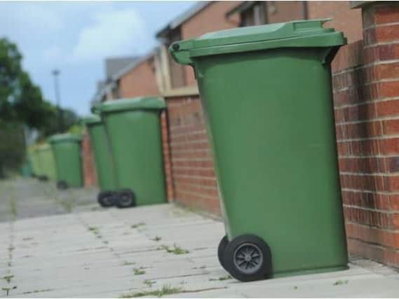 Green waste bins waiting collection along King George Road, South Shields.