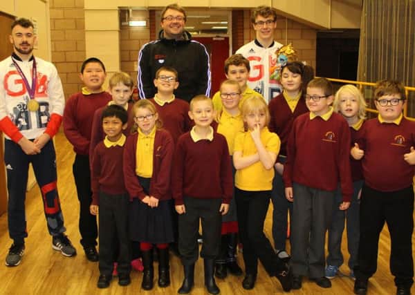 Josef, left, Danny, centre, and Matt with the pupils