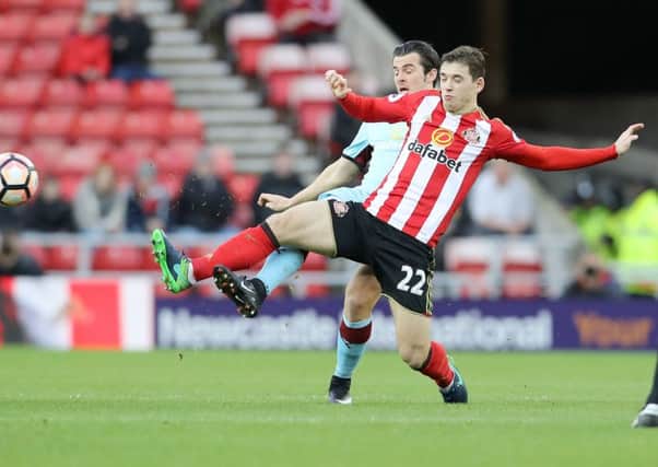 Sunderland's Donald Love (right) and Burnley's Joey Barton battle for the ball