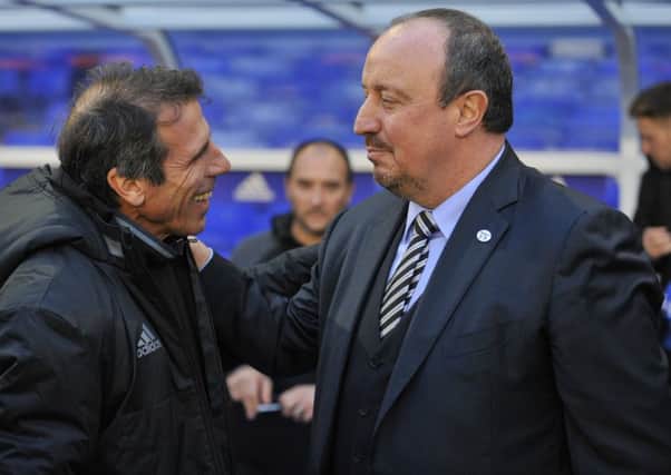 Rafa Benitez shakes hands with Gianfranco Zola.