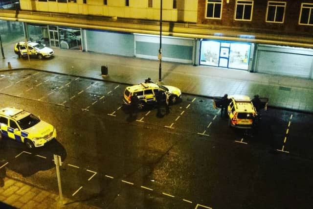 Police surround the Coral bookmakers in the Viking Centre, Jarrow. Pic: Stephen Dixon.