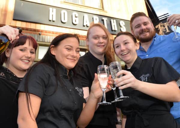 Hogarths pub staff, from  left,Chloe Grant, Beth Ingham and Amy Burton. Manager Natasha Caisley and Martin Wood
