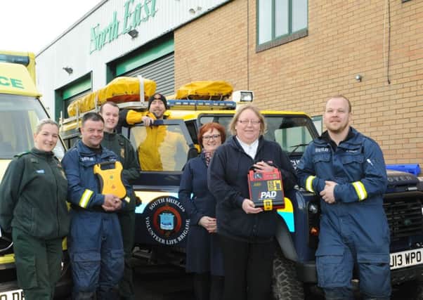 Stacey and Luke donate defibrillators to, from left, Charlie Torrence, South Shields Volunteer Life Brigade volunteer, John Maughan, South Shields Volunteer Life Brigade volunteer, Joanne McGowan, project administrator at Salvation Army Southwick Community Project, Julie Judson, child and family worker at Salvation Army Southwick Community Project and Gary Hannah, South Shields Volunteer Life Brigade captain.